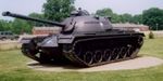 180px-This_M48A2C_features_three_track_return_rollers,_and_lacks_the_small_track_tensioning_idler_previously_found_between_the_last_road_wheel_and_drive_sprocket.jpg