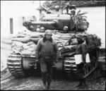 M4A3E8 General PAtton in front of the M4A3E8 tank of the 14th Armoured Division.jpg