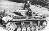 Panzer III with crew driving out in the open