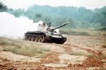303px-T-62_main_battle_tank_laying_a_smokescreen.JPG