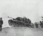 239px-Men_of_the_9th_Infantry_Regiment_man_an_M-26_tank_to_await_an_enemy_attempt_to_cross_the_Naktong_River..gif