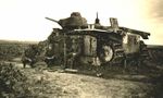 Destroyed French Char B1 bis tank, identity and location unknown. Note the Cross of Lorraine unit insignia on the tank's turret - the spade insignia identifies this tank as being in the first section of its tank company..jpg