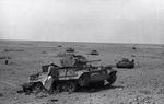 German inspecting an knocked out Australian Matilda II somewhere in the North-African desert.jpg