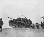 Men of the 9th Infantry Regiment man an M-26 tank to await an enemy attempt to cross the Naktong River..gif