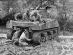79th Ordnance Co. soldiers repairing a Sherman tank in the mud at their field depot, in the Cassino corridor of battle.Italy ,February 1944.jpg